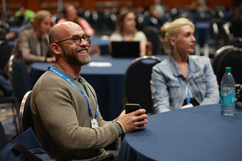 ATD conference attendee smiling during a session